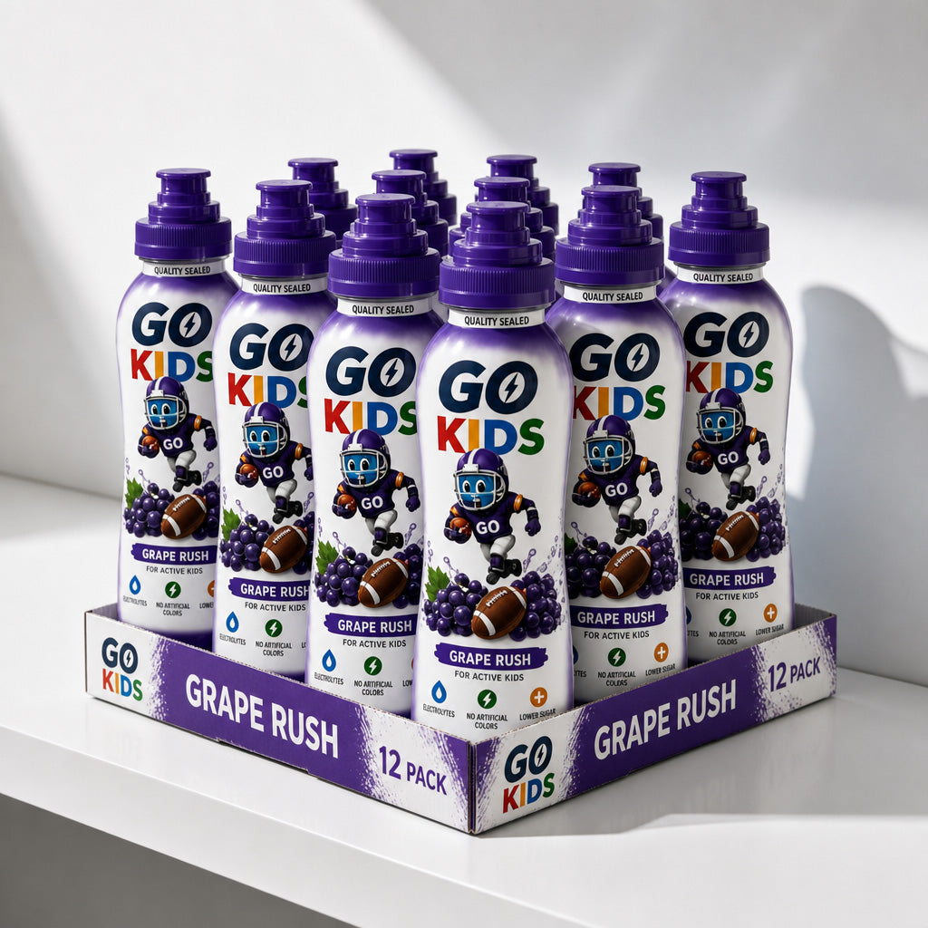 A 12-pack display of GO KIDS Grape Rush sports drink bottles arranged on a branded cardboard tray on a white shelf against a light gray background.