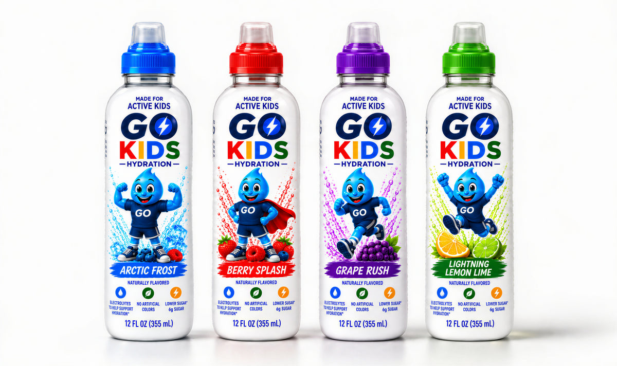Four bottles of GO KIDS drinks arranged side by side on a white background, each with a different colored cap and flavor label: Arctic Frost in blue, Berry Splash in red, Grape Rush in purple, and Lightning Lemon Lime in green.